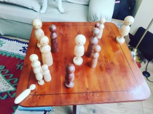 One-to-one, in-person Family Constellation with figurines on a table or board.